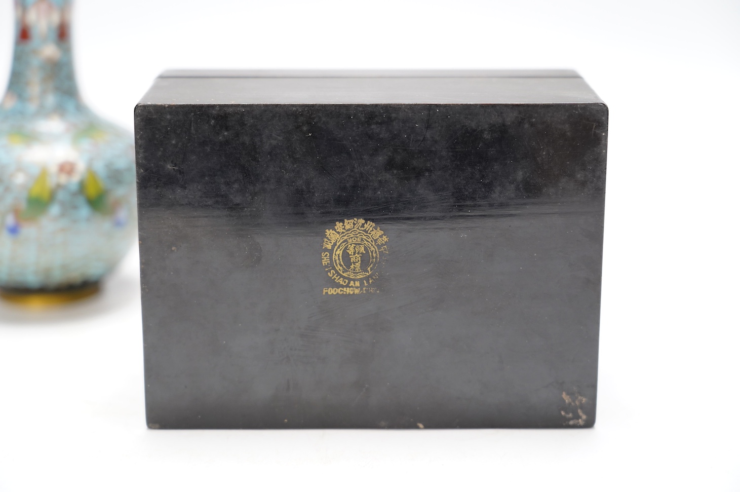 A Chinese cloisonné enamel vase, 13cm, and a set of five graduated lacquer boxes, the lids with inlaid silver decorations, largest 13.5 x 10 x 6.5cm. Condition - good